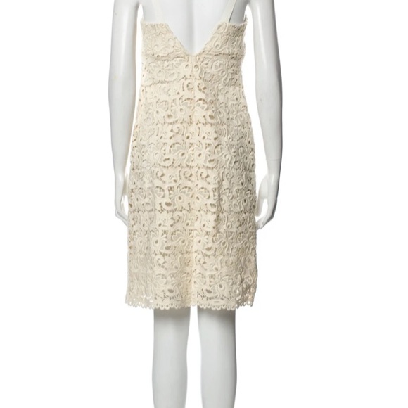 Ivory lace dress by Michael Kors is in like new condition. Size 2 - Picture 4 of 16